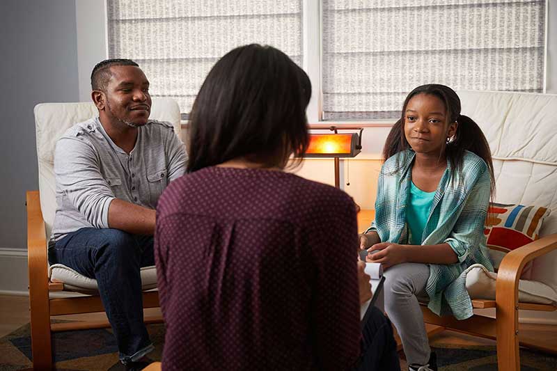 dad and daughter in therapy sessions